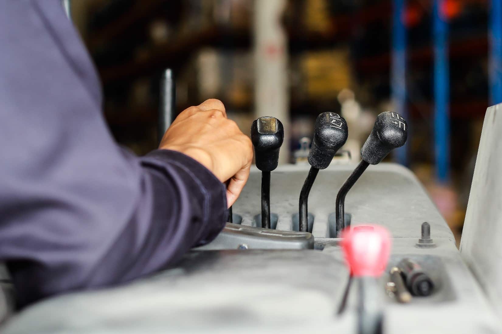Man making forklift repairs