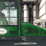 A green and black combilift in a warehouse
